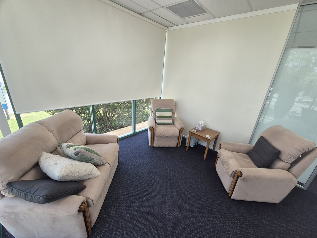 This picture shows Jenna's therapeutic room set-up. The armchairs pictured are where clients would typically be seated. Jenna would typically sit in the armchair that is pictured in the bottom right.