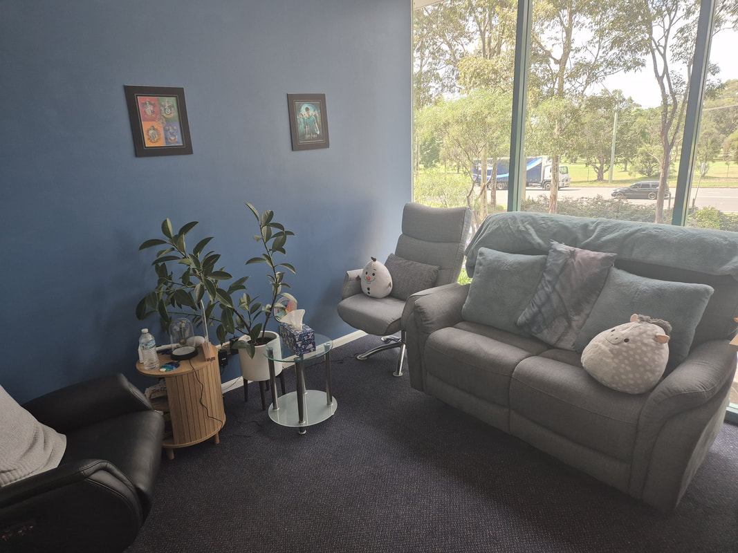 This picture shows Nicholas' therapeutic room set-up. The armchair pictured at the bottom left is typically where Nicholas would be seated. The sofa and armchair closest to the window is where the client would typically be seated. The therapy pod is often used by children, adolescent and adult clients.